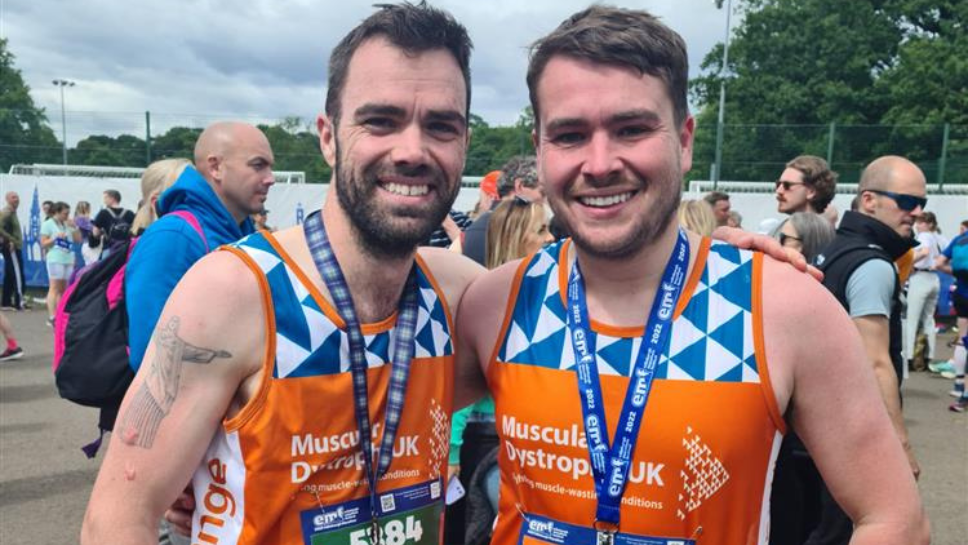 Edinburgh Marathon finishers with medals around neck after race
