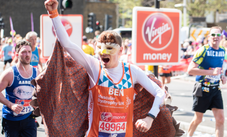 A runner at the London Marathon in 2018 dressed up in a superhero costume