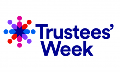 Trustees Week logo: Navy blue font reading 'Trustees' Week' with an purple, pink, orange and blue star-like shape.